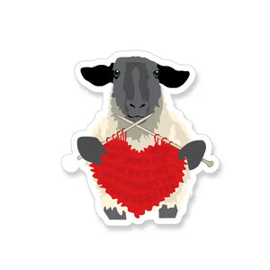 sheep knitting with red heart